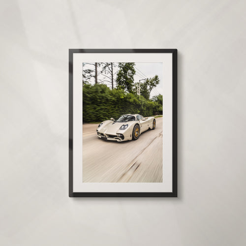 Green Flag: framed print of a Pagani Utopia at speed past green hedges