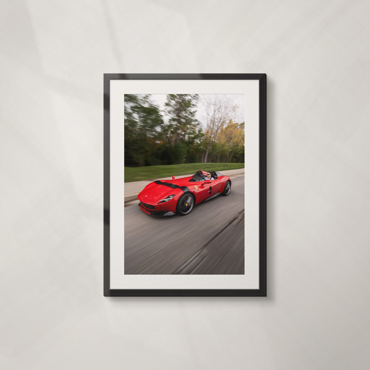 Rosso: framed print of a red Ferrari Monza SP at speed on a tree-lined road